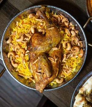 Wood smoked mendi chicken slow roasted over mendi rice at Darna Mediterranean Grill